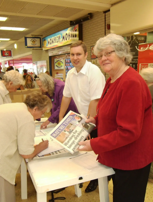 Janet Rowe, Michael Mullaney and Denise Wood collecting signatures