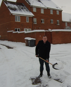 Cllr Stuart Bray lends a hand clearing streets in Hinckley